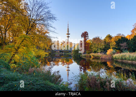 City park Planten un Blomen at autumn. View of Heinrich Hertz Tower is radio telecommunication tower in Hamburg. Germany Stock Photo