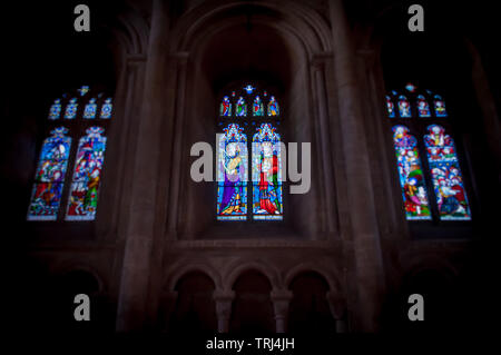 Three stained glass windows in Peterborough Cathedral Stock Photo