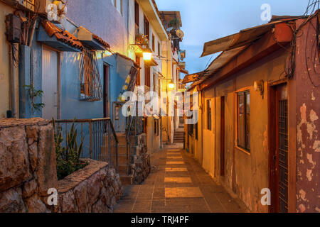 Narrow street in the historic quarter Barrio las Penas in Guayaquil, Ecuador at twilight. Stock Photo