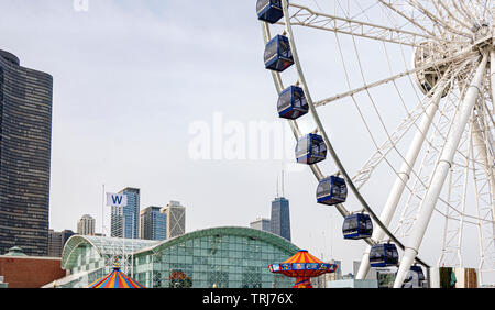 Chicago, IL, USA, October 2016: Chicago's Navy Pier with the Ferris wheel and city skyline with skyscrapers in the background Stock Photo