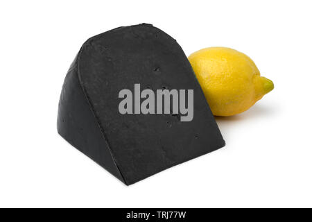 Piece of black lemon cheese and a fresh yellow lemon isolated on white background Stock Photo