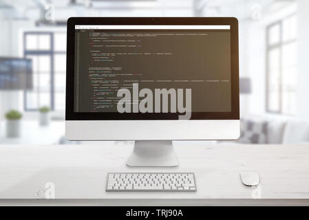 Computer display with code editor. The concept of a developer workplace. The office is in the background. Stock Photo