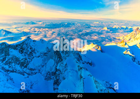 Aerial view of Dent du Geant in a sea of clouds at sunrise, Chamonix, Haute Savoie, France Stock Photo