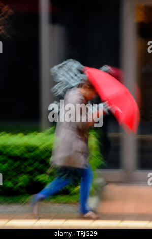 struggling in the rain Kanazawa Japan Stock Photo