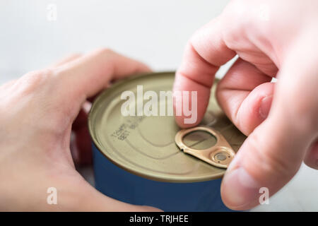 Close-up finger pull opening loop of canned food Stock Photo