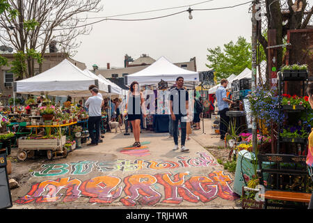 The Bushwick Market in Bushwick, Brooklyn in New York during the annual Bushwick Collective Block Party on Saturday, June 1, 2019. Music and partying brought some but the real attraction was the new murals  by 'graffiti' artists that decorate the walls of the buildings that the collective uses.  (© Richard B. Levine) Stock Photo