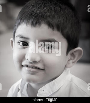 Kerala, India - November 27, 2015: A Black and white portrait of a Smiling Cute little Indian boy Stock Photo
