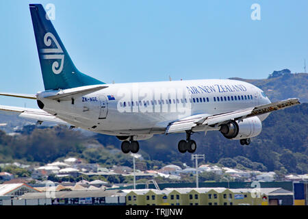 An Air New Zealand Boeing 737-3U3 comes in to land at Wellington airport, New Zealand. This aircraft has subsequently left the fleet. Stock Photo