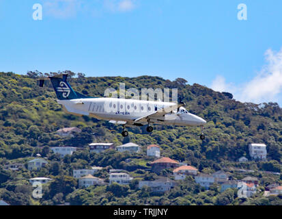 An Air New Zealand Beechcraft 1900D comes in to land at Wellington airport, New Zealand Stock Photo