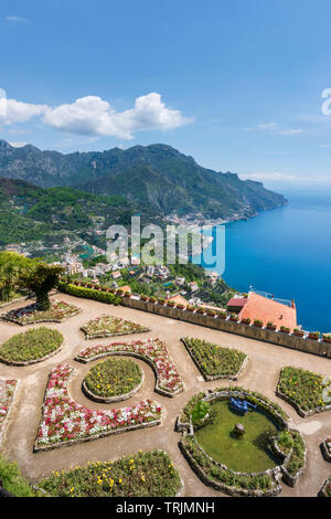 Formal flowerbeds terrace and spectacular view of the Amalfi Coast  seen from Villa Rufolo Gardens in Ravello in Campania Southern Italy Stock Photo