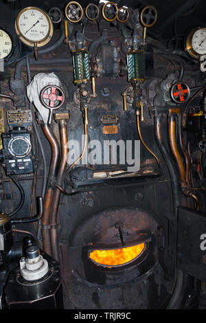 The engineers foot plate and controls for the steam locomotive Union of South Africa 60009 LNER A4 Class during a water stop at Chirk railway station Stock Photo