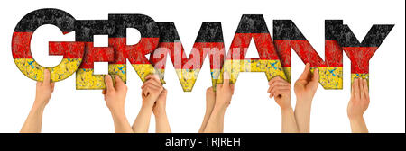 people arms hands holding up wooden letter lettering forming word Germany in german national flag colors tourism travel nation concept isolated on whi Stock Photo