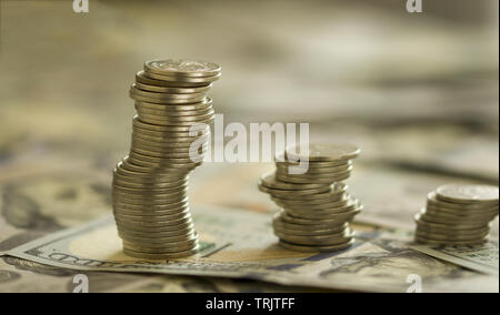Coins Stack on the one hundred dollars banknotes. Financial growth concept. concept of strategy of profit or benefit making in business. Stock Photo