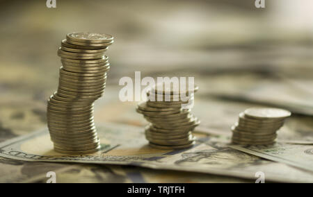 Coins Stack on the one hundred dollars banknotes. Financial growth concept. concept of strategy of profit or benefit making in business. Stock Photo