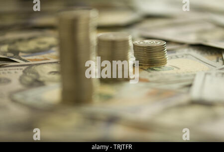 Coins Stack on the one hundred dollars banknotes. Financial growth concept. concept of strategy of profit or benefit making in business. Stock Photo