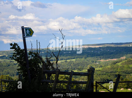 Welsh footpath sign pointing out over the Clwydian Range of mountains in the North East of Wales, UK Stock Photo