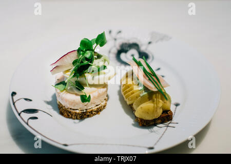 Traditional, open faced sandwiches on a ceramic plate in Denmark, Copenhagen Stock Photo