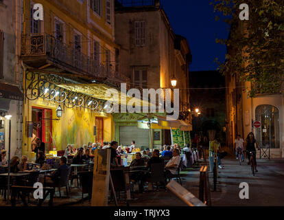 Café Van Gogh in Arles, Provence-Alpes-Cote d'Azur, France - September 15, 2010: Warm summer evening in café at the Place du Forum Stock Photo