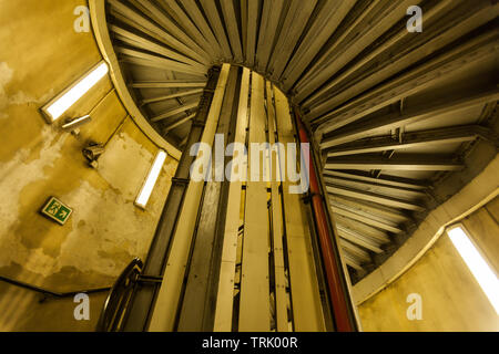 Spiral staircase at Queensway underground subway station, London, England, United Kingdom. Stock Photo