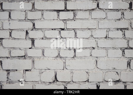 White abstract background in the form of a simple painted brick wall without inscriptions and drawings Stock Photo