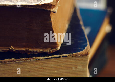 Stack of old vintage multi-page books with shabby covers of different colors Stock Photo