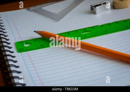 Pencil and rule on a notebook Stock Photo