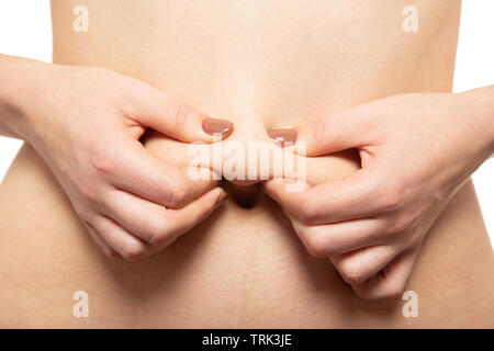 punch oversized female buttocks with cellulite on white background Stock Photo