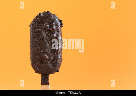 Ice cream sticks isolated on a yellow background Stock Photo