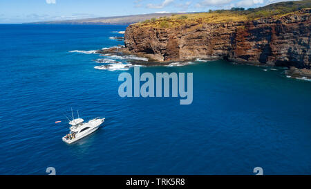 An aerial view of The Jayhawk, a charter boat based in Lahaina, Maui. It is pictured on the backside  of Lanai near Kaumalapau Harbor, Hawaii. Stock Photo