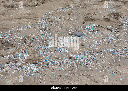Thousands and thousand of bits of plastic mark the high water mark on this Northshore beach. Much of the north side of the island of Maui in inaccessi Stock Photo