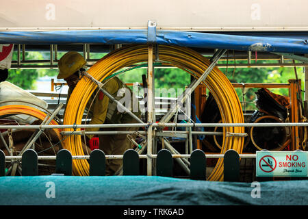 Singapore-02 APR 2019：indian worker working on construction truck Stock Photo