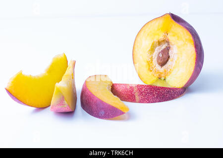 Close up of beautiful elegant composition from ripe juicy red nectarines on white background Stock Photo