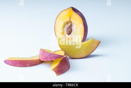Close up of beautiful elegant composition from ripe juicy red nectarines on white background Stock Photo