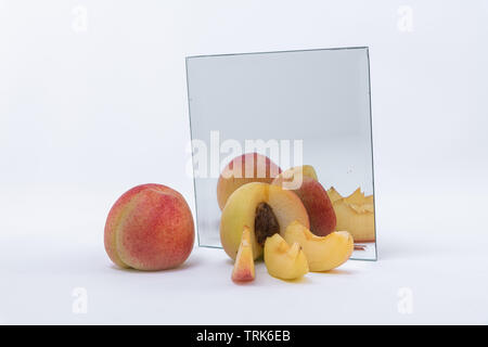 isolated apricots on a white background. Just harvested apricots on a mirror reflection Stock Photo