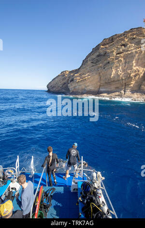 Scuba divers being picked up on the Backwall outside Molokini Crater, Maui, Hawaii. Stock Photo