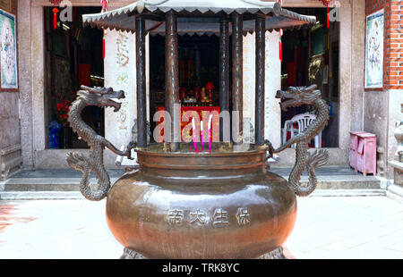 Incense burning in front of Zhongde Temple, Gulangyu Island, Xiamen, China (closeup) Stock Photo
