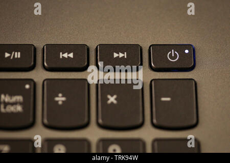 Details with the Power ON/OFF button on a laptop/computer keyboard. Stock Photo