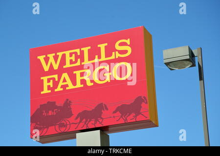 Wells Fargo sign against a blue sky at a branch in Boulder City, Nevada, USA Stock Photo