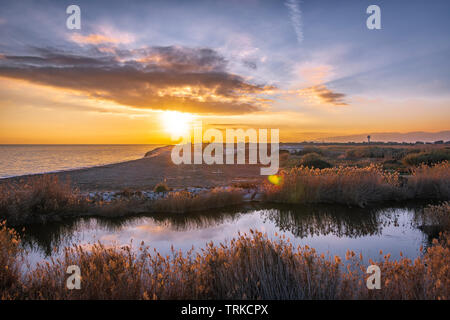 sunset at the mouth of the river Stock Photo