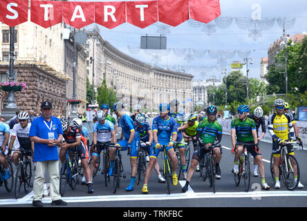 Group of cyclists standing in front of the start line. Cycle race among amateurs devoted to Day of Kiev. May 25, 2019. Kiev, Ukraine Stock Photo