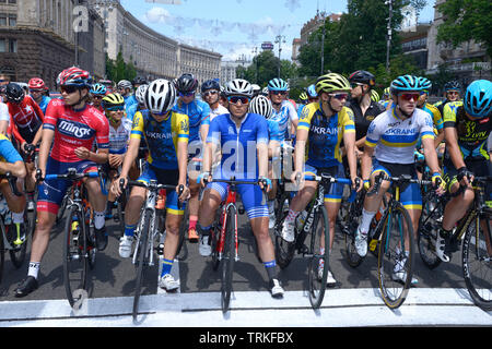 Group of cyclists standing in front of the start line. Cycle race among amateurs devoted to Day of Kiev. May 25, 2019. Kiev, Ukraine Stock Photo