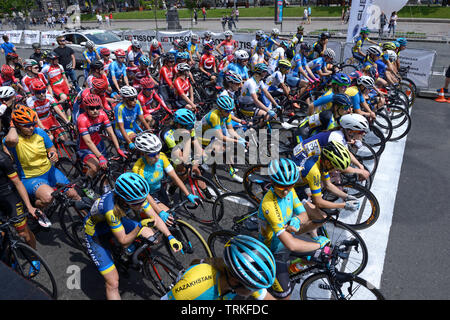 Group of cyclists standing in front of the start line. Cycle race among amateurs devoted to Day of Kiev. May 25, 2019. Kiev, Ukraine Stock Photo