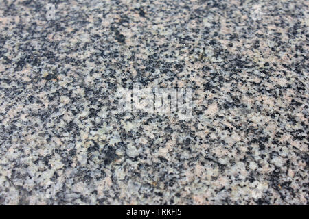 Granite textured background of grey and black color mineral stone Stock Photo