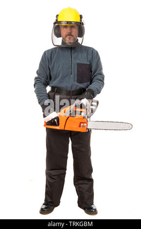 Man in safety gear holding chainsaw Stock Photo