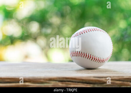 baseball on Abstract background and red stitching baseball. White baseball with red thread.Baseball is a national sport of Japan. It is popular. Stock Photo
