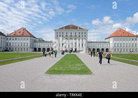 May  2019. Visitors walking the gardens of Schloss Nymphenburg in Munich, Germany Stock Photo