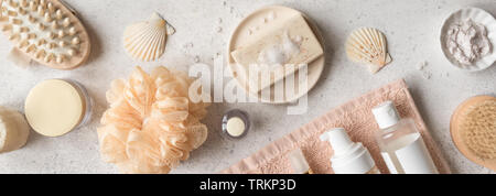 Bath Accessories on white stone background, top view, banner. Daily bodycare concept, organic bath products. Stock Photo