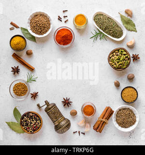 Various Spices on white background. Assortment, set of spices and condiments with vintage pepper mill, top view, copy space. Stock Photo