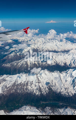 The view out of an Edelweiss Airbus A320 flying over Switzerland Stock Photo