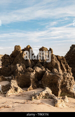 Rocky outcrop on a beach, forming this natural stone monument on the Costa Vicentina in Porto Covo, Portugal, Europe. Stock Photo